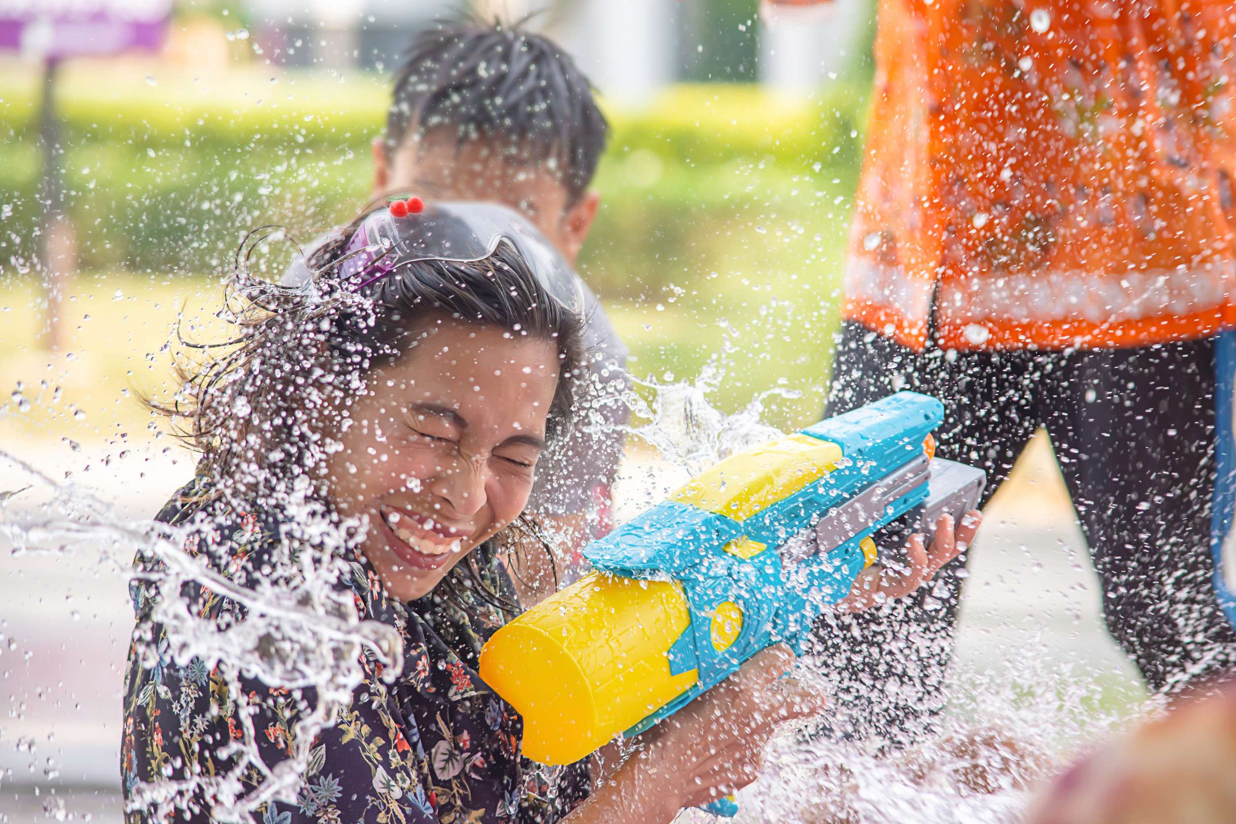 Asian Woman Holding A Water Gun Play Songkran Festival